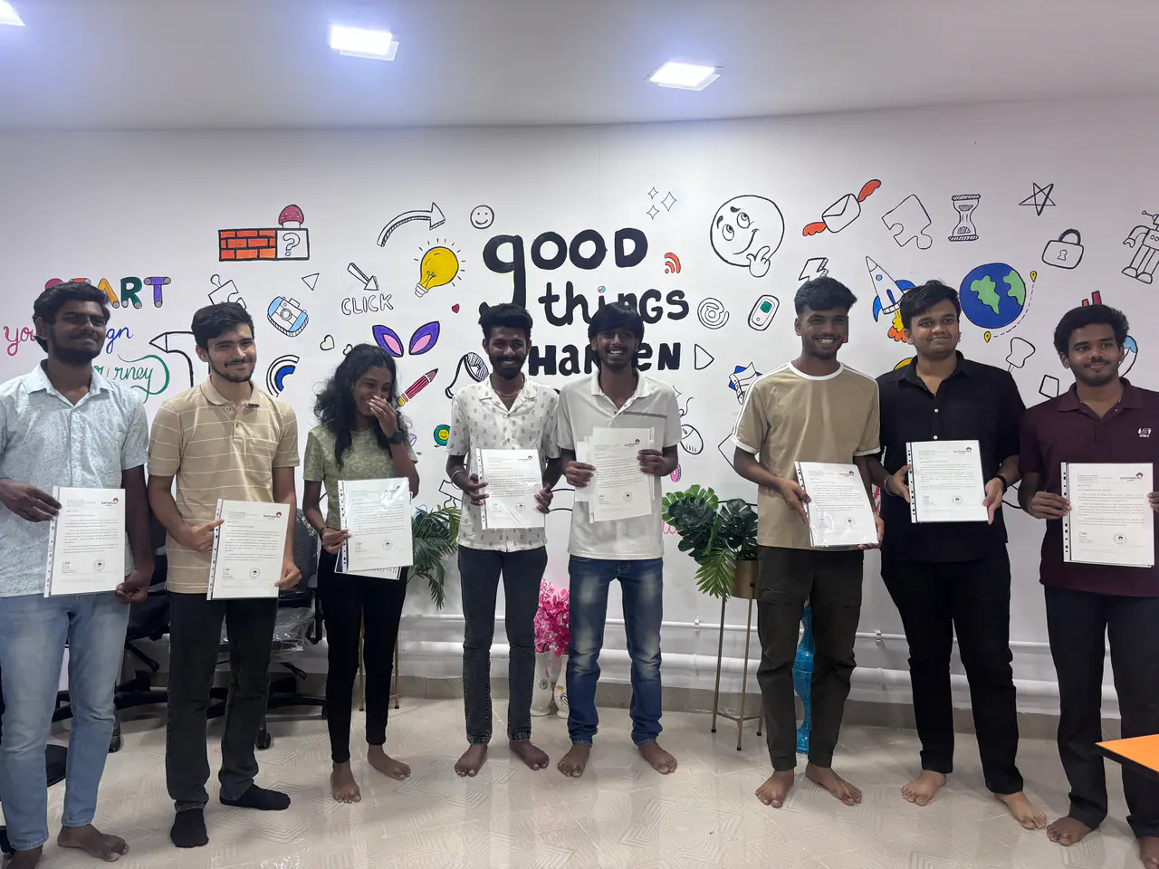 Ovi Design Academy students on graduation day, holding their course completion certificates